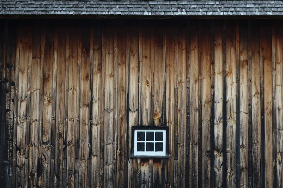 a wooden building with a window on the side of it
