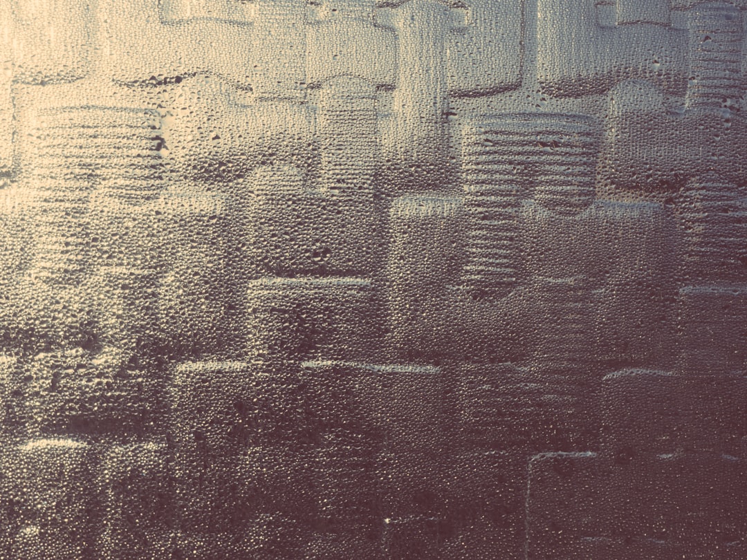 a close up of a window with rain drops