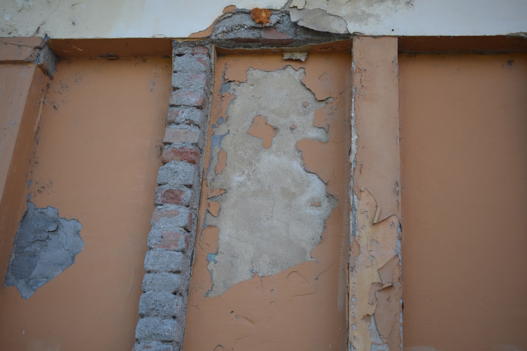 865a3fe118304da3bb38c5bd7048014b a brick wall with a hole in the middle of it