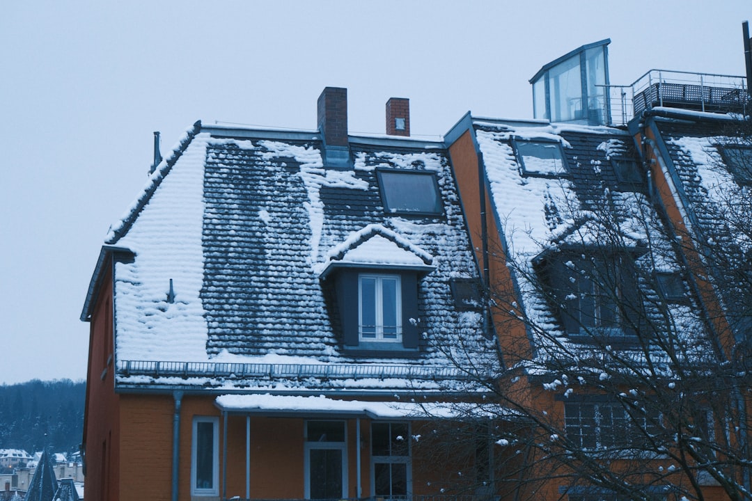 Snow covered rooftops of traditional european buildings