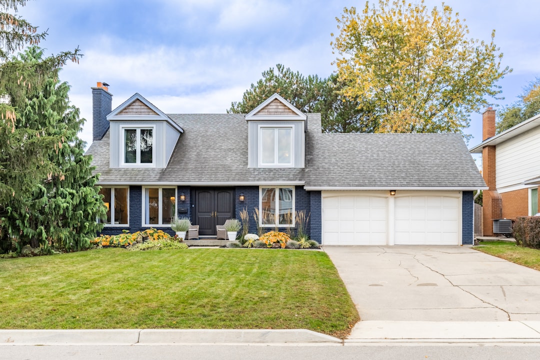 Nice house with two-car garage and green lawn