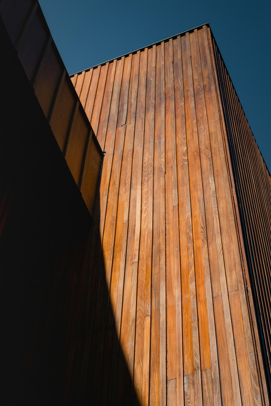 Wooden building exterior against a clear blue sky