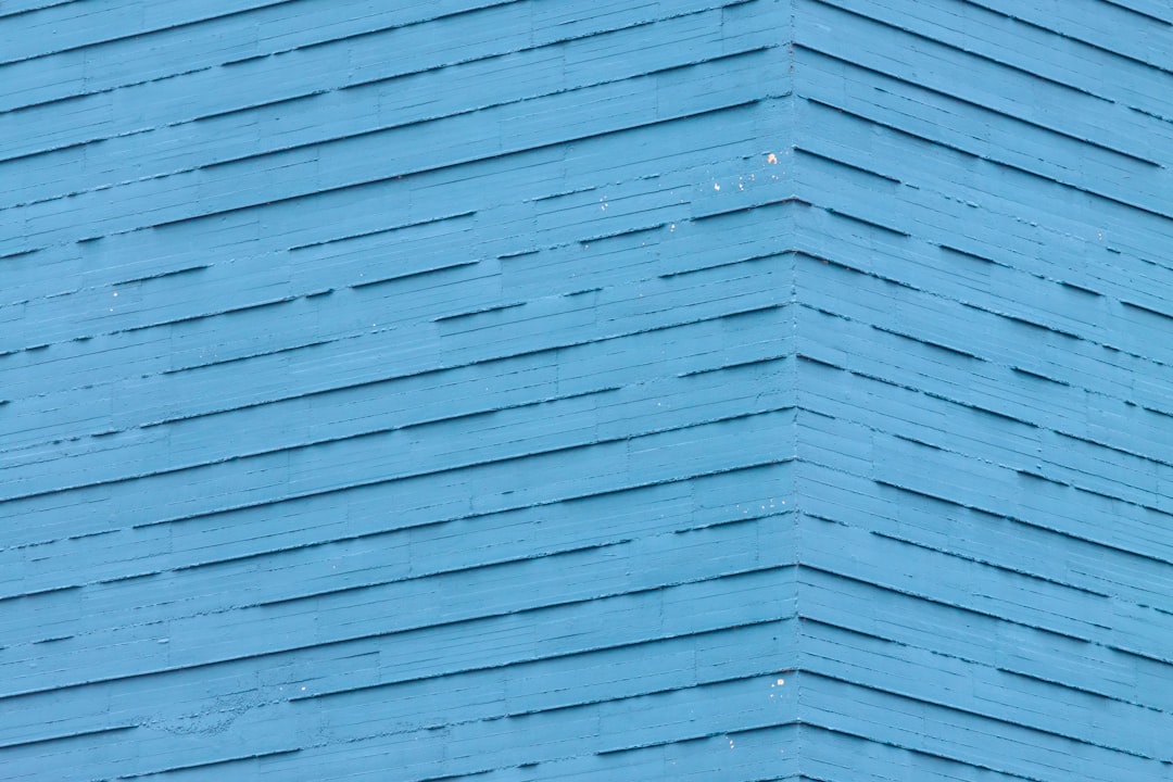 Blue wooden planks with a textured surface and zigzag pattern