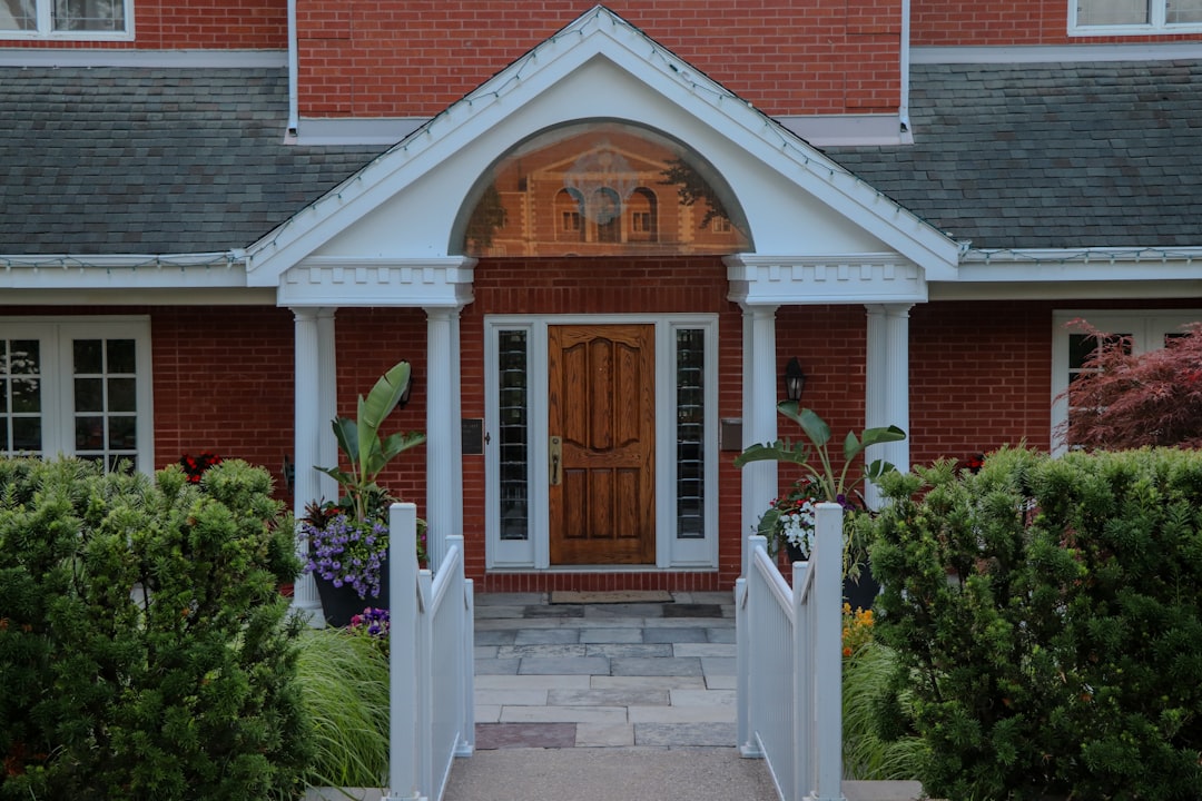 Elegant front entrance of a red brick house