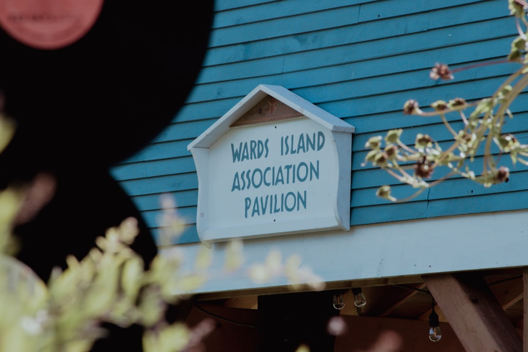c967bdd478a845fb86749a6f04735a53 Wards island association pavilion sign on blue building