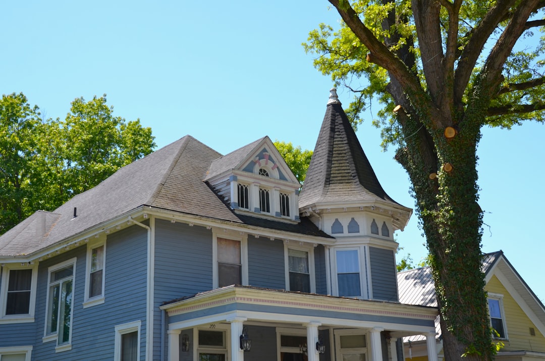 d3343c4f344b45909444a0ebd4c0d072 A blue victorian house with a turret