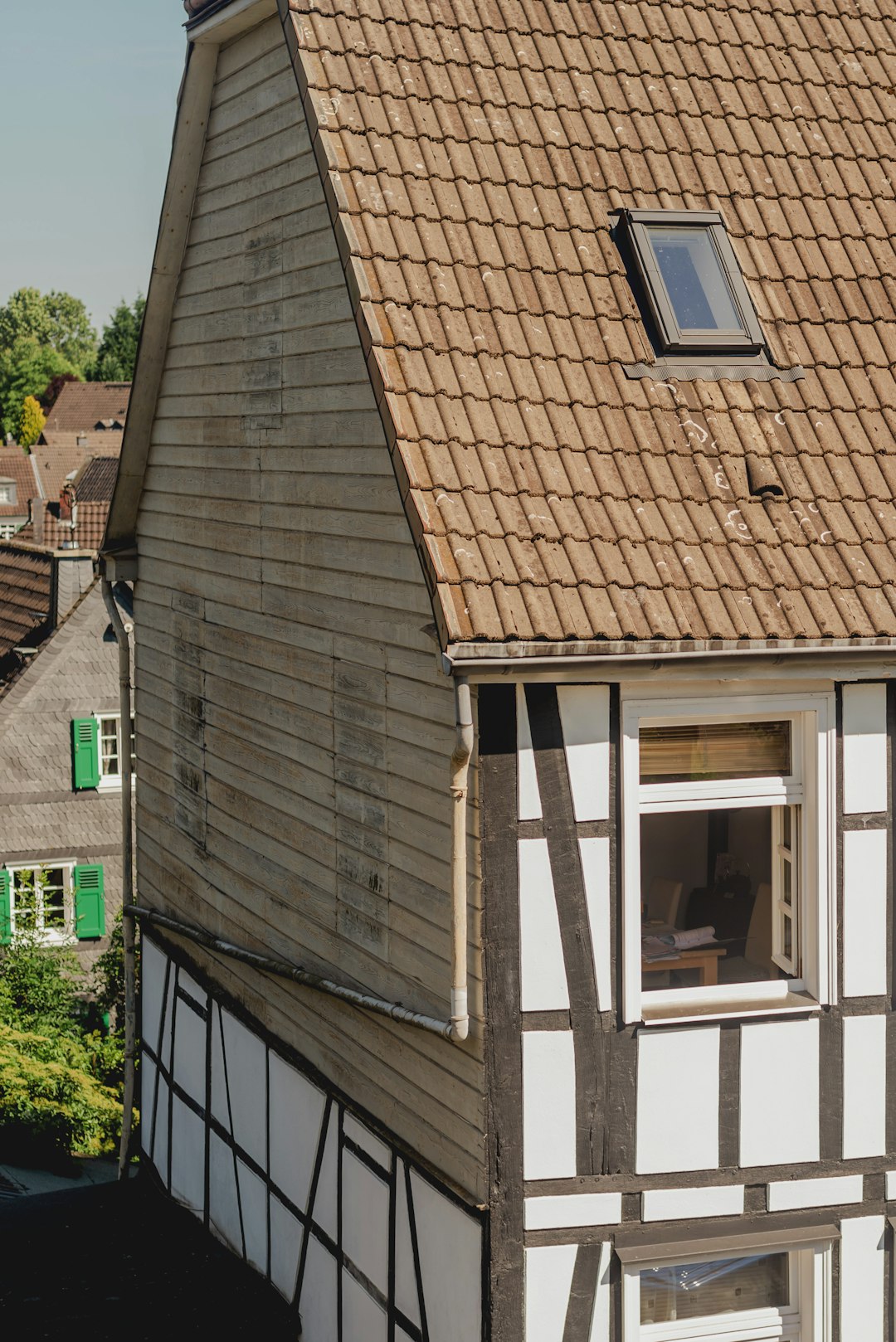 d52cf8b11a8a4df6af333aae30ecae2c Traditional half-timbered house with tiled roof