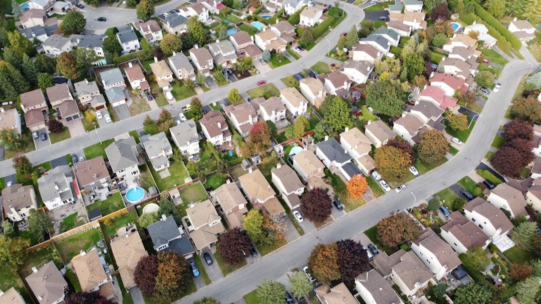 d6ba7f80319c4cf193aa11726c16331c an aerial view of a neighborhood with lots of houses