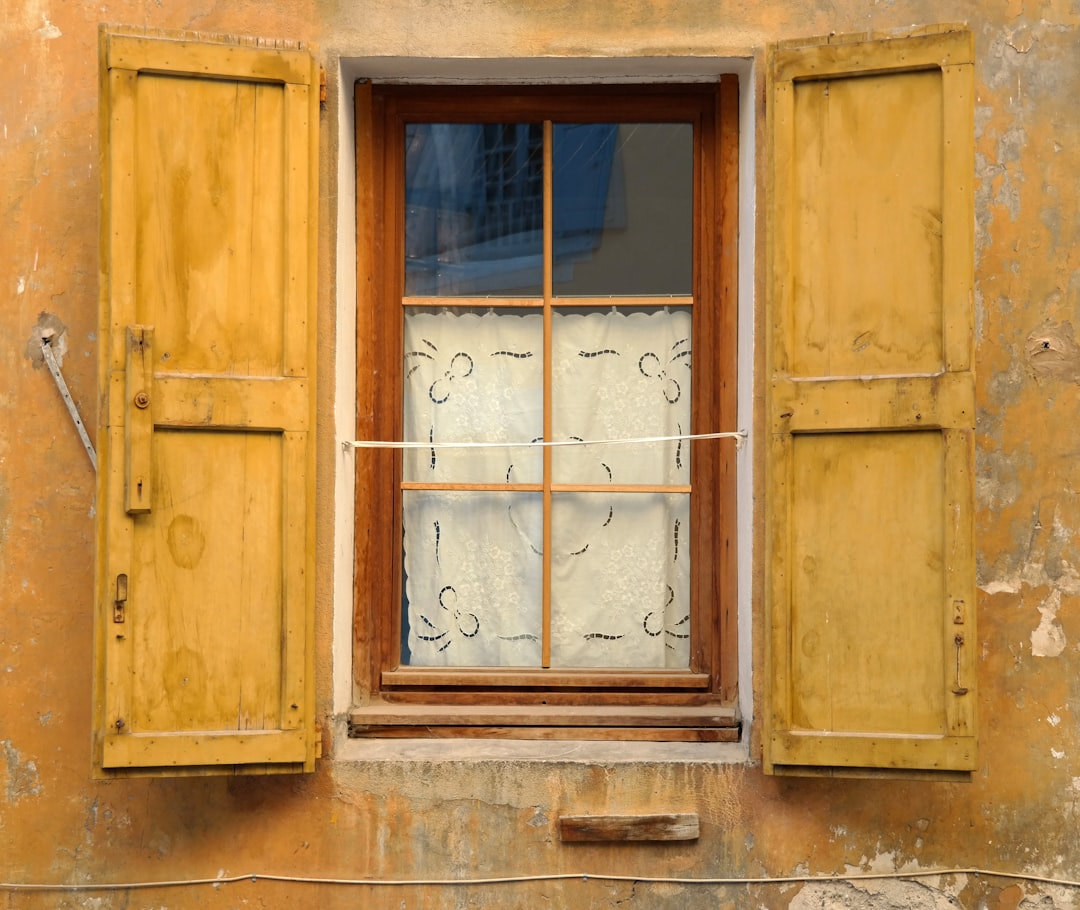 d976749d073c4ea69e4323dd7c3b946c photo of brown wooden window open