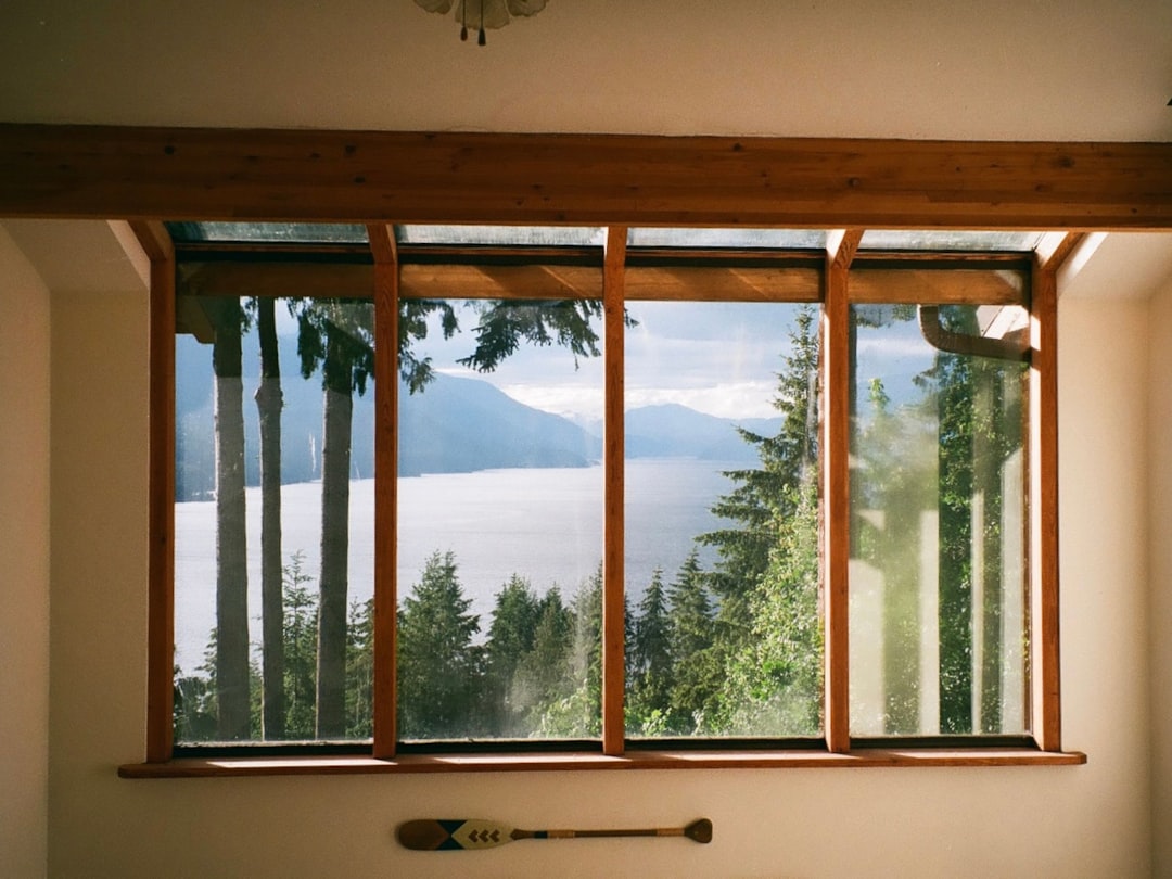 ec59acda2c644632a24c257b08dcbb80 a window with trees outside