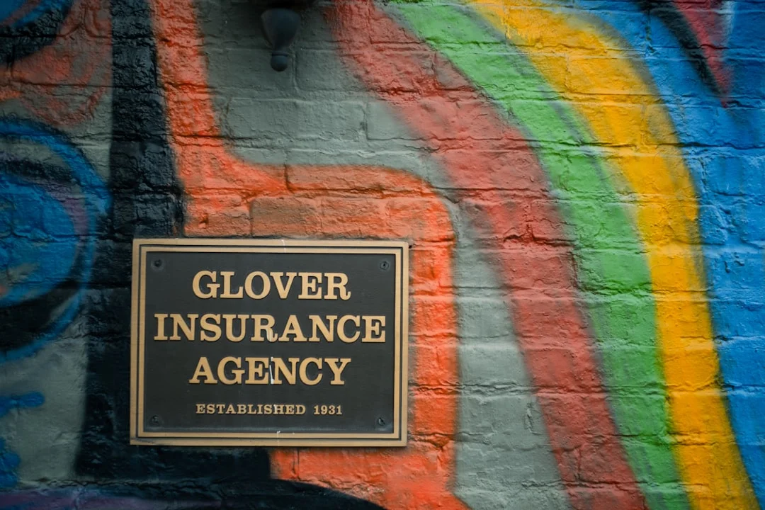 Glover Insurance Agency Mural a sign on a brick wall that says glover insurance agency