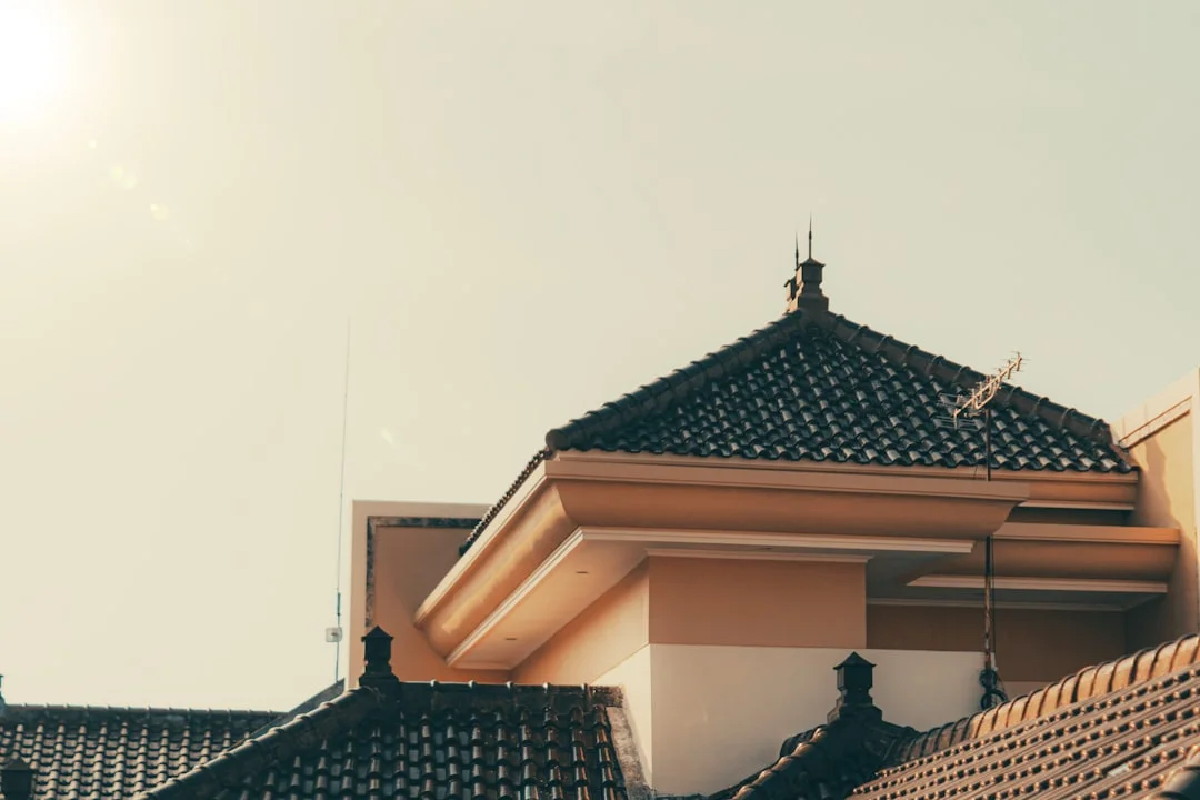 Building's roof under a bright, sunny sky.