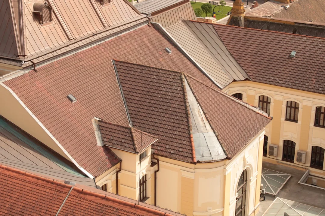 an aerial view of a building with a clock tower