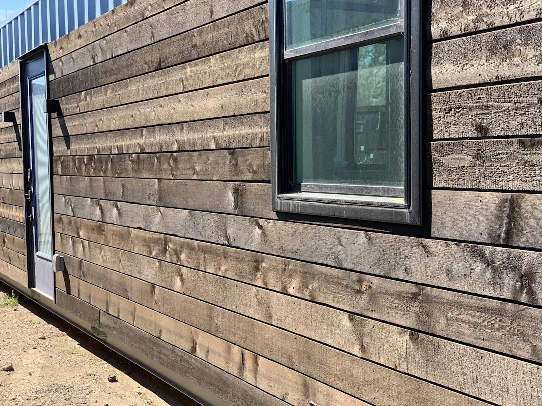 a close up of a wooden building with a window