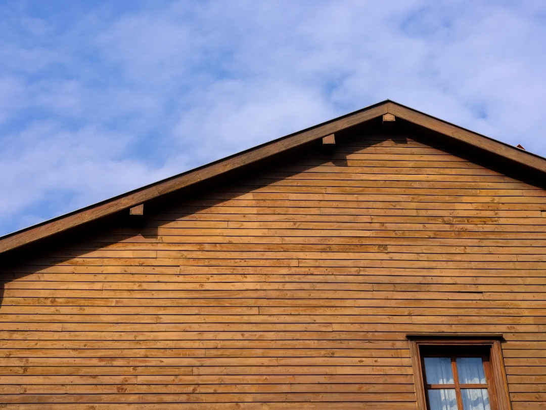 a wooden building with a blue sky