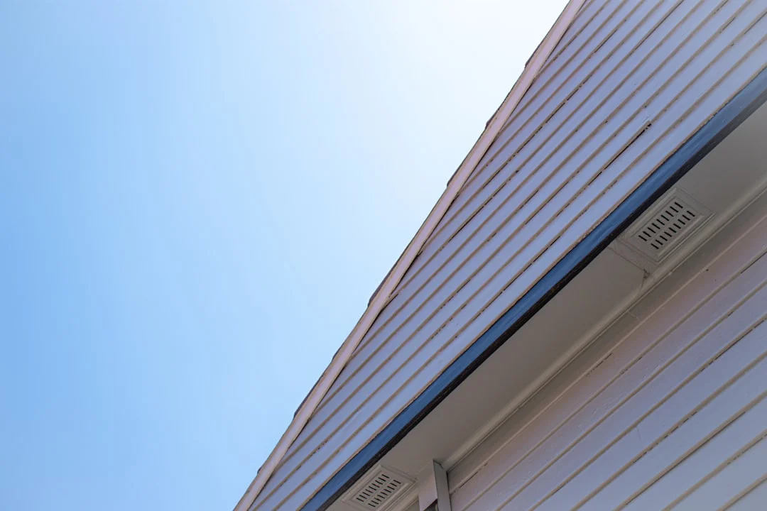 Building Exterior with Vent Grilles a close up of a building with a blue sky in the background