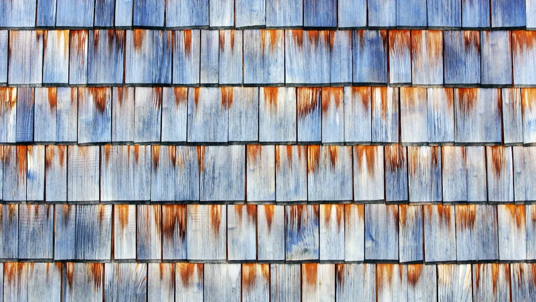 Wooden Shingles Close-Up Weathered wooden shingles with streaks of rust and blue.