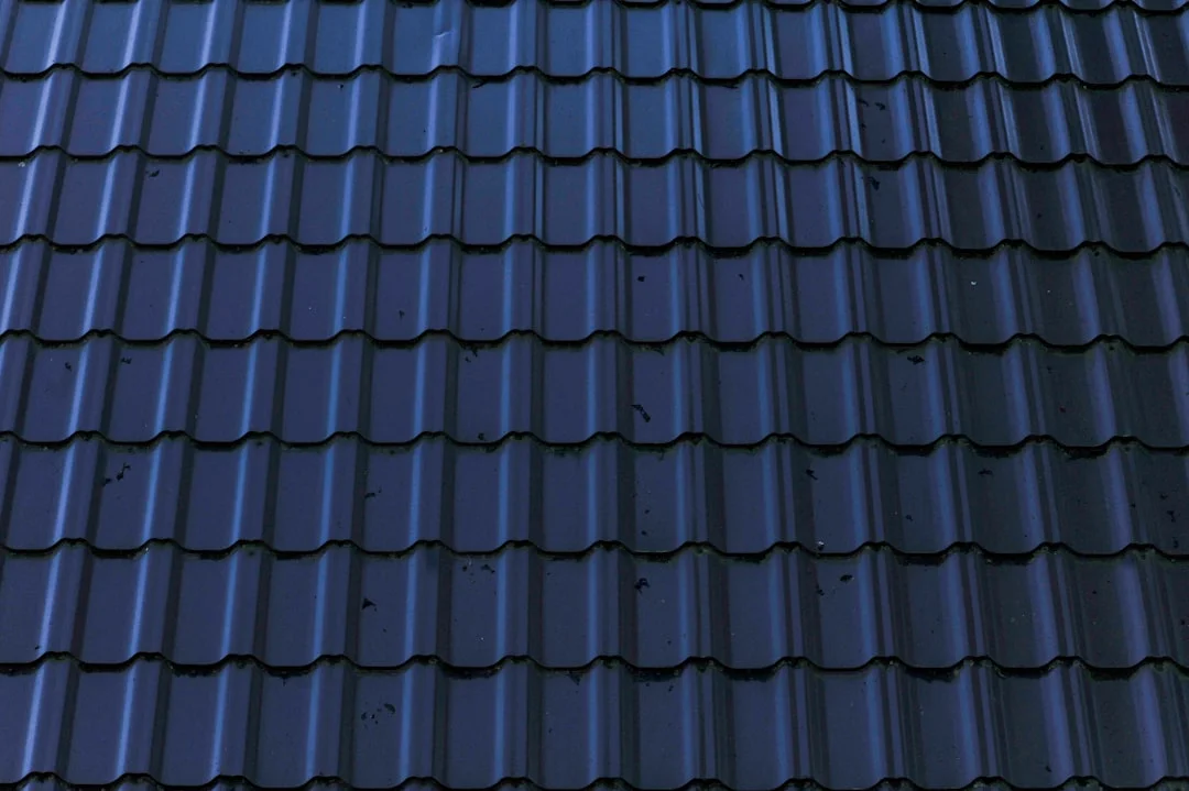 Blue Corrugated Roof Close-Up a close up of a roof with a blue tint