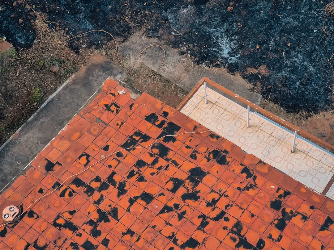 An overhead view shows a scorched roof.