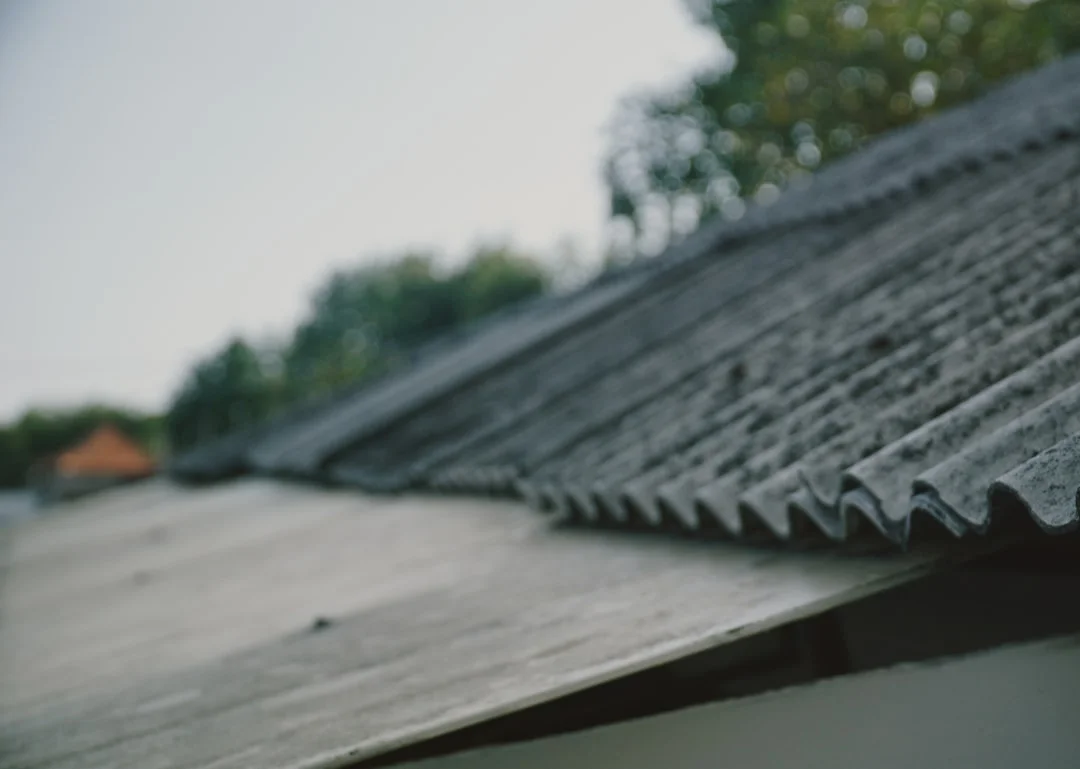 Gray Ceramic Tile Roof Close-Up Close-up of a sloped roof with gray ceramic tiles